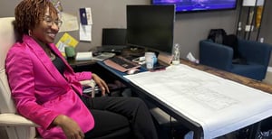 Jessica Brant seated at a desk in her office